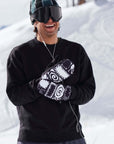 The KO Mitt x Glitterstudio Black gloves with Primaloft insulation and Hipora waterproof inserts while on snowy slopes